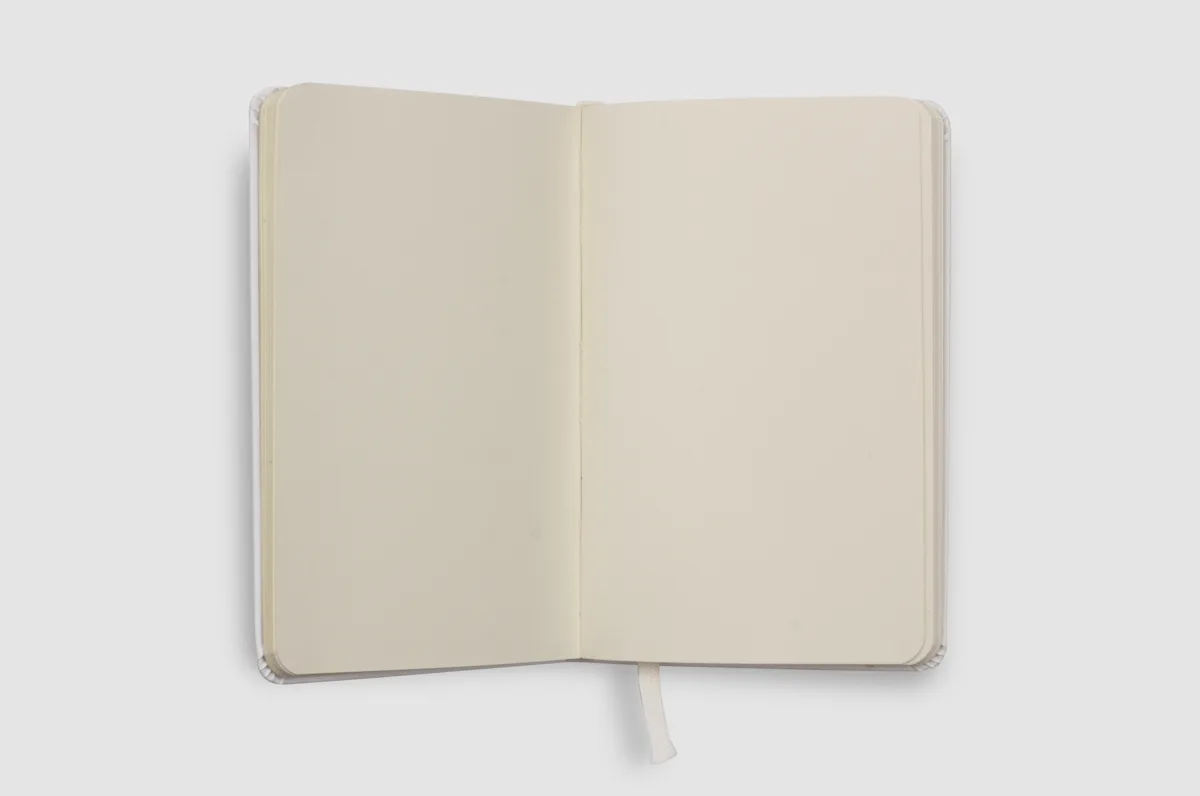 Open notebook showing smooth cream blank pages