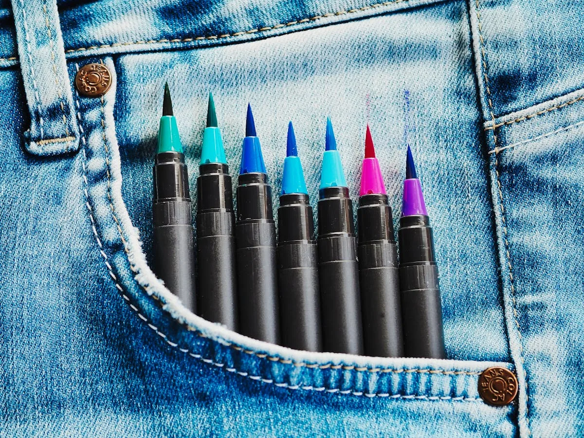 A row of colorful brush pens used for bullet journal lettering