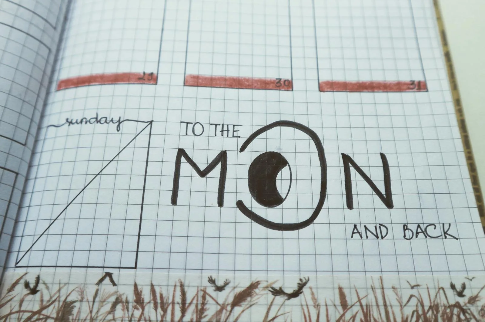 Hand-lettered monthly cover page in a bullet journal