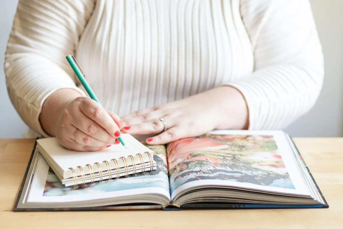 A person writing the first setup pages of a new bullet journal