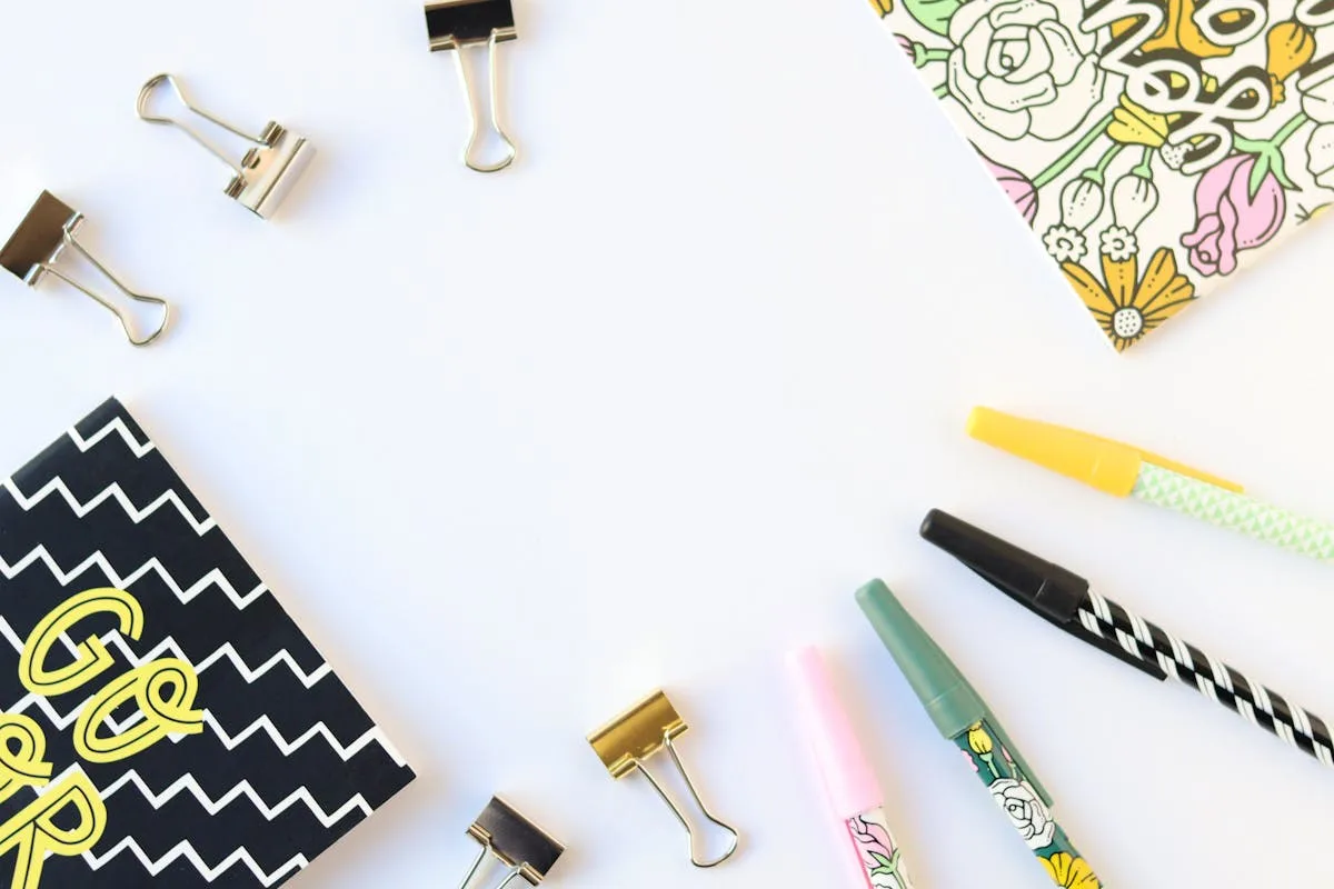 Colored pens beside an open bullet journal