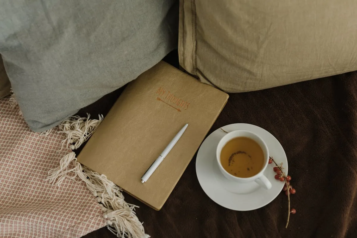 Cozy journaling setup with a notebook and coffee