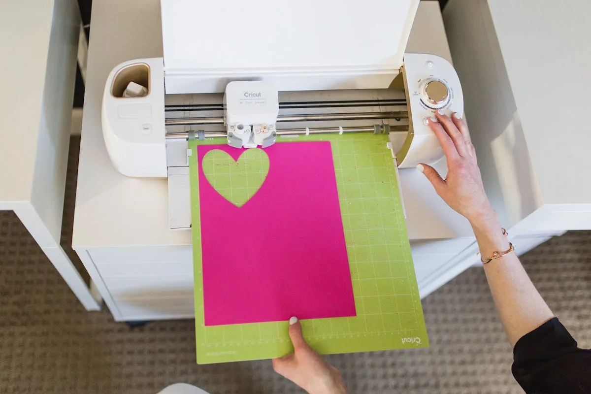 Feeding material into a craft cutting machine to cut stickers