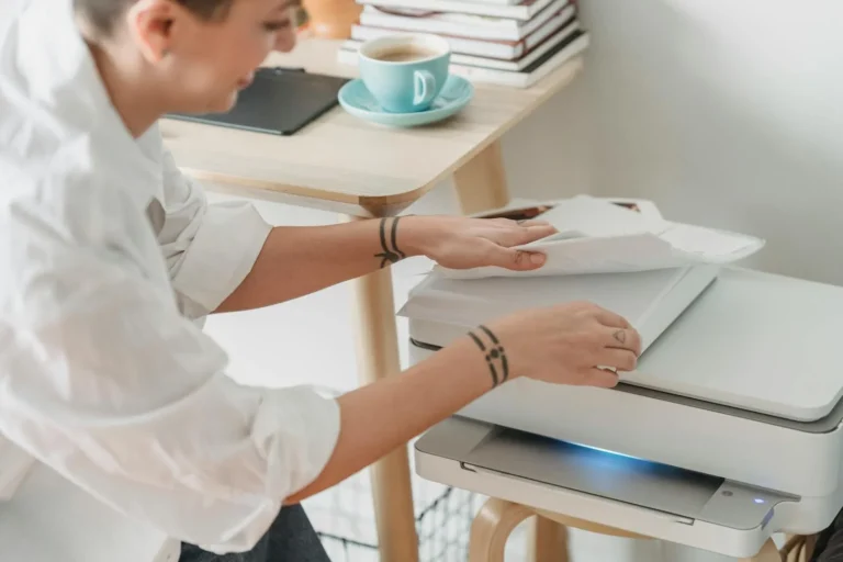 Woman preparing paper for printing junk journal pages