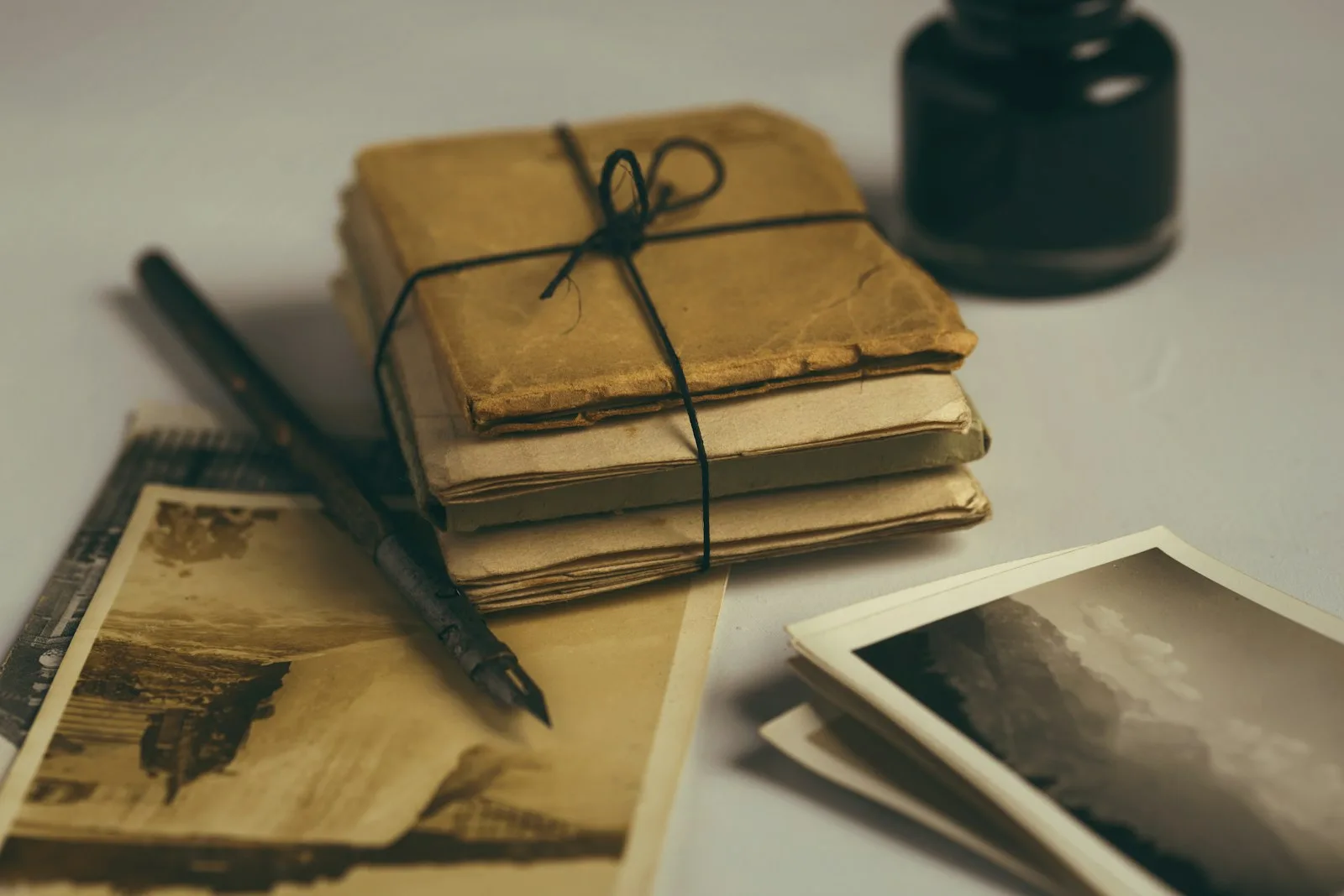 Open junk journal with brown paper and a black pen on a desk