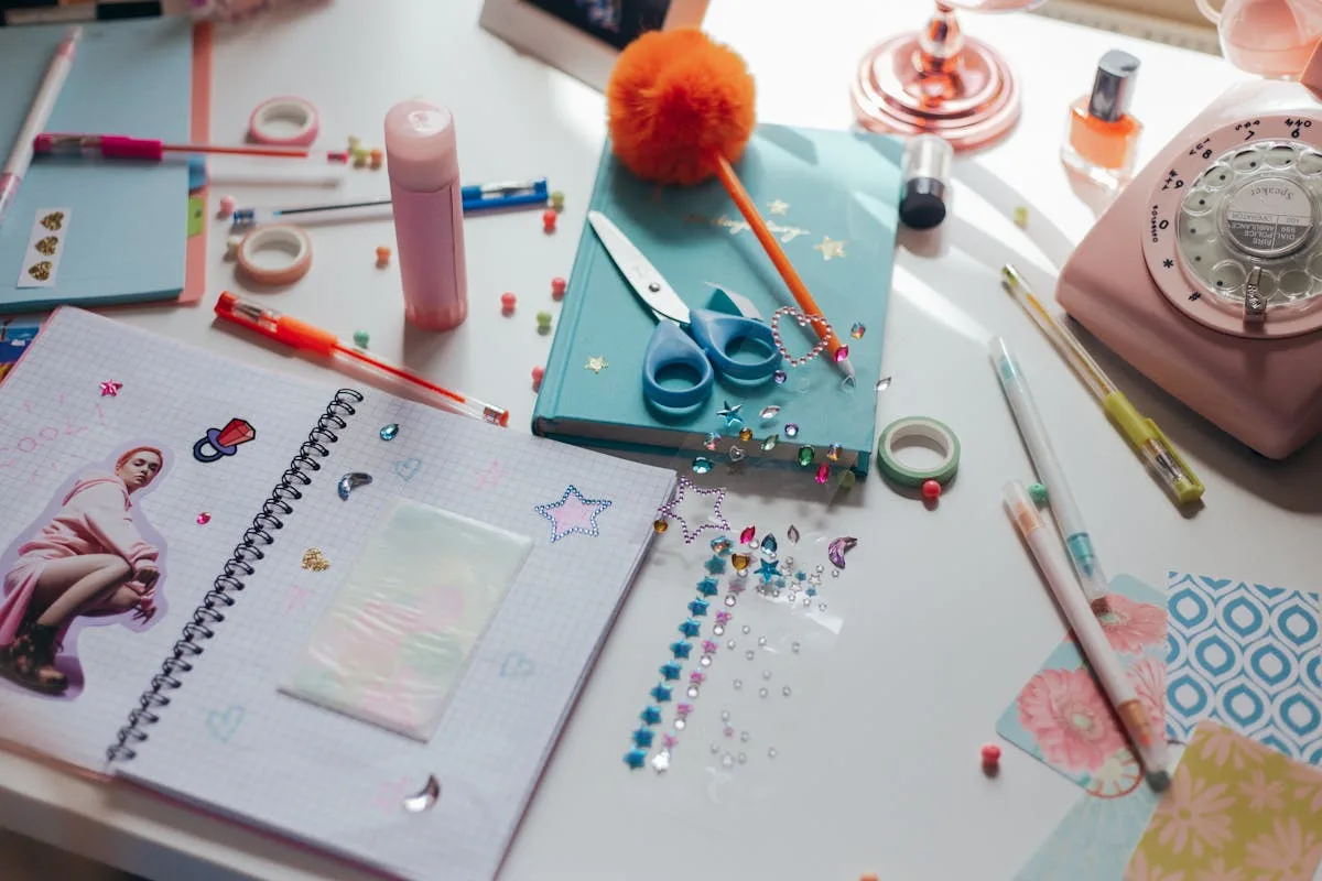 Art materials laid out for making a junk journal page