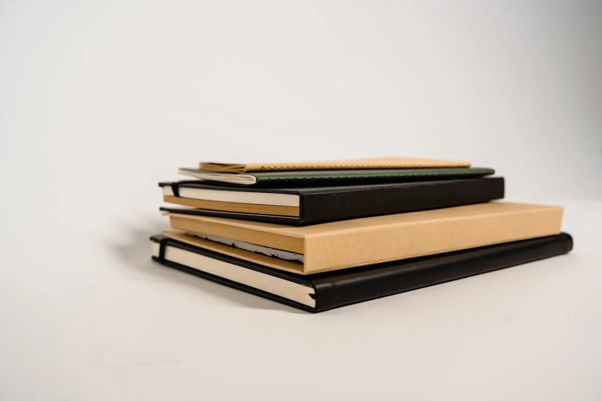 Assortment of notebook types including kraft, hardback, and bound journals