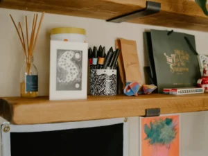 Warm craft desk with paper and supplies for printing stickers at home