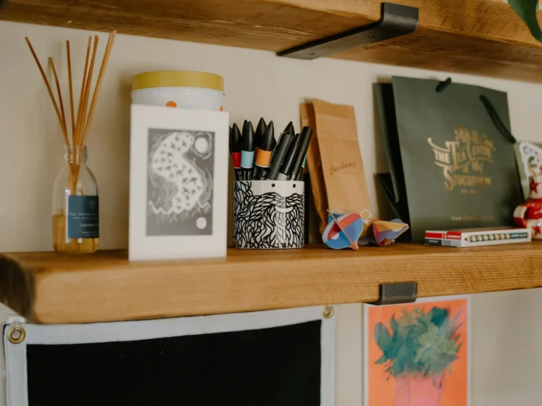 Warm craft desk with paper and supplies for printing stickers at home