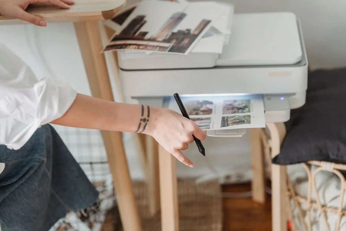 Home inkjet printer on a bright desk for printing scrapbook paper at home