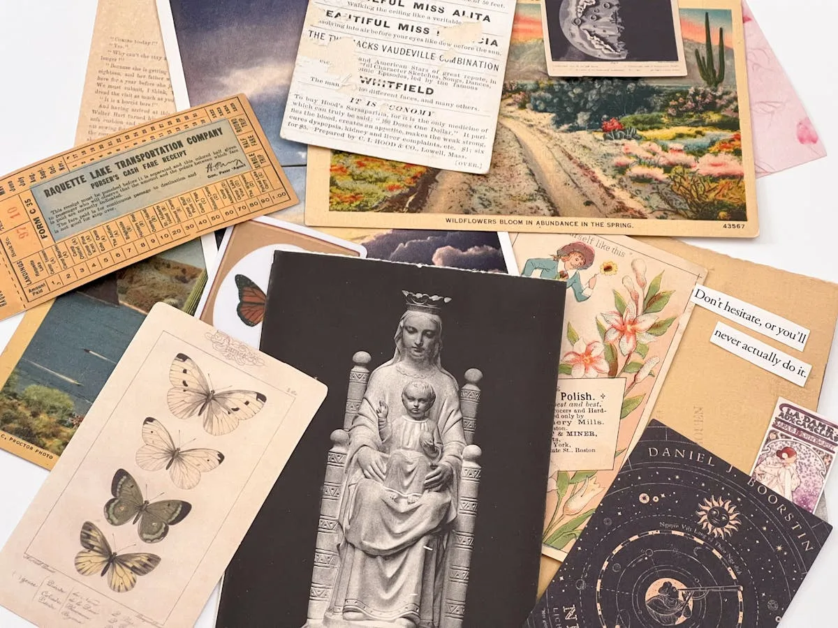 Open passport with visa stamps on a scratch-off world map, surrounded by travel journal pages and a pen