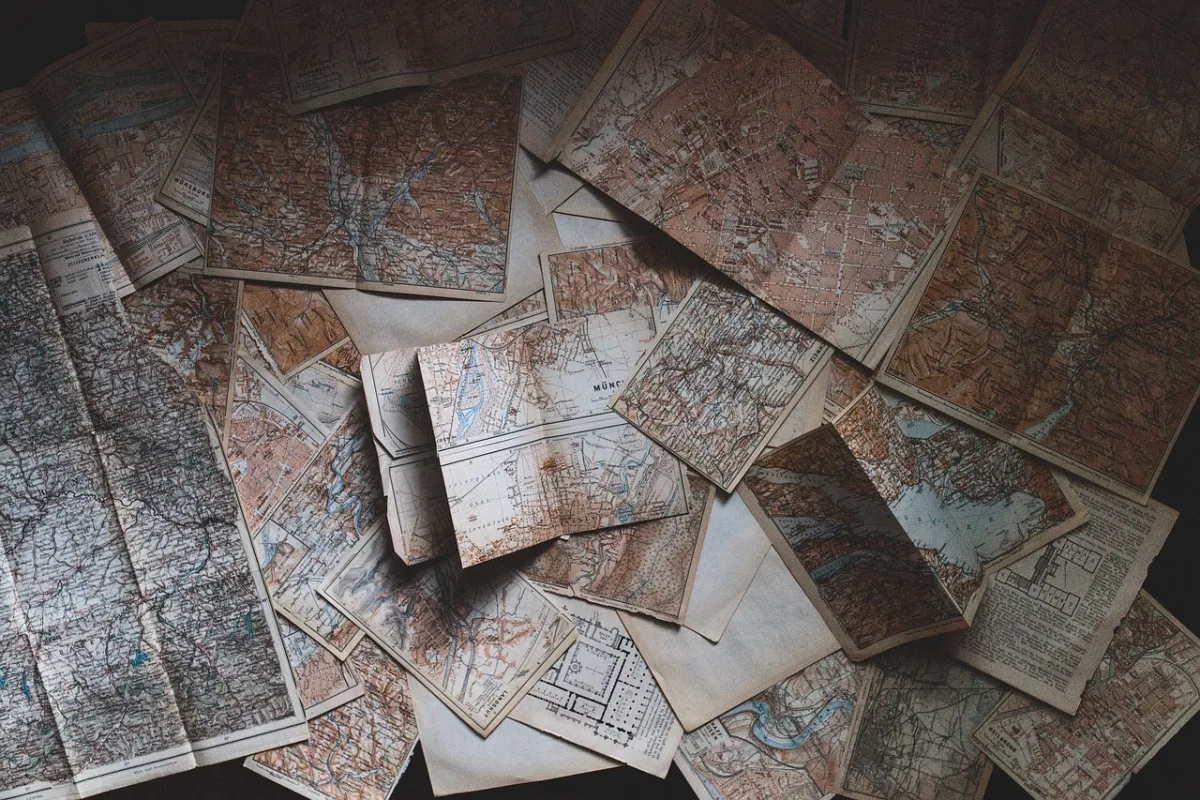 Layered vintage maps used as a junk journal background page
