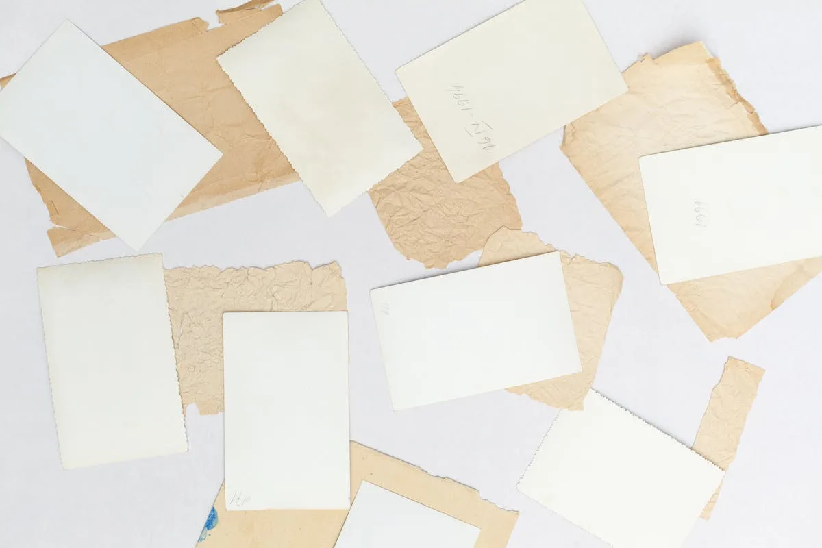 Assortment of vintage cream and tan paper scraps for junk journaling
