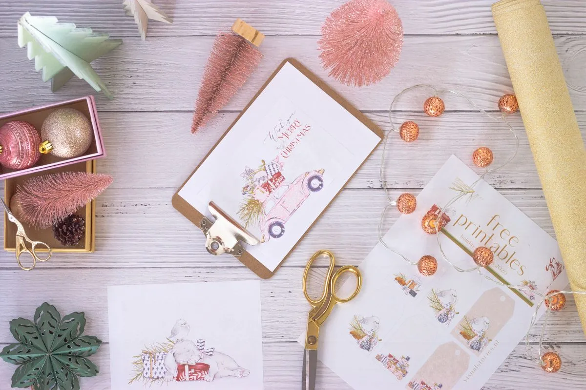 Printed quote cards and scissors on a craft table ready to cut and glue onto a vision board