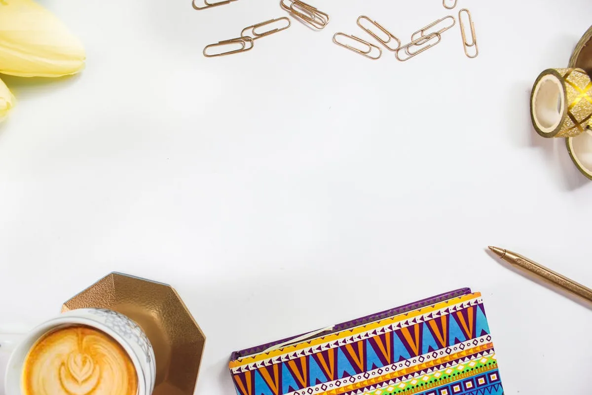 Washi tape rolls and a pen on a bright white desk
