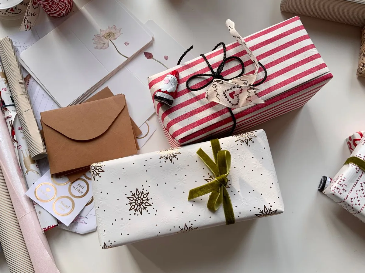 Wrapped gifts and handwritten gift tags saved as Christmas scrapbook keepsakes