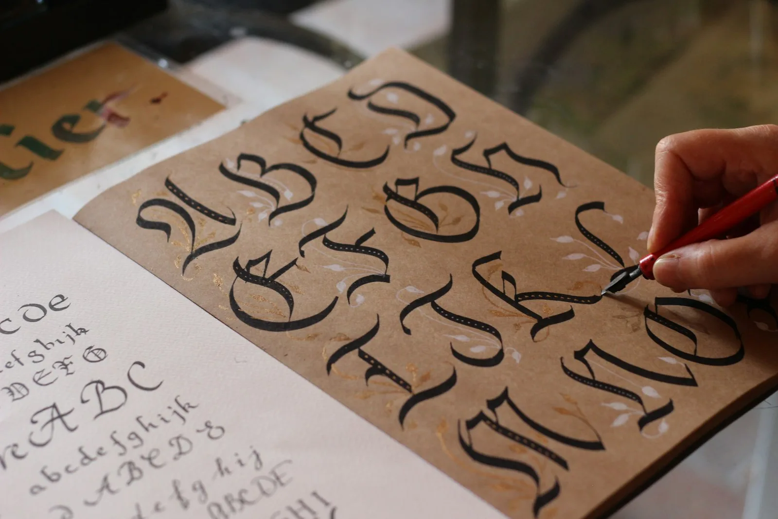 Modern calligraphy practice with a brush pen on warm paper